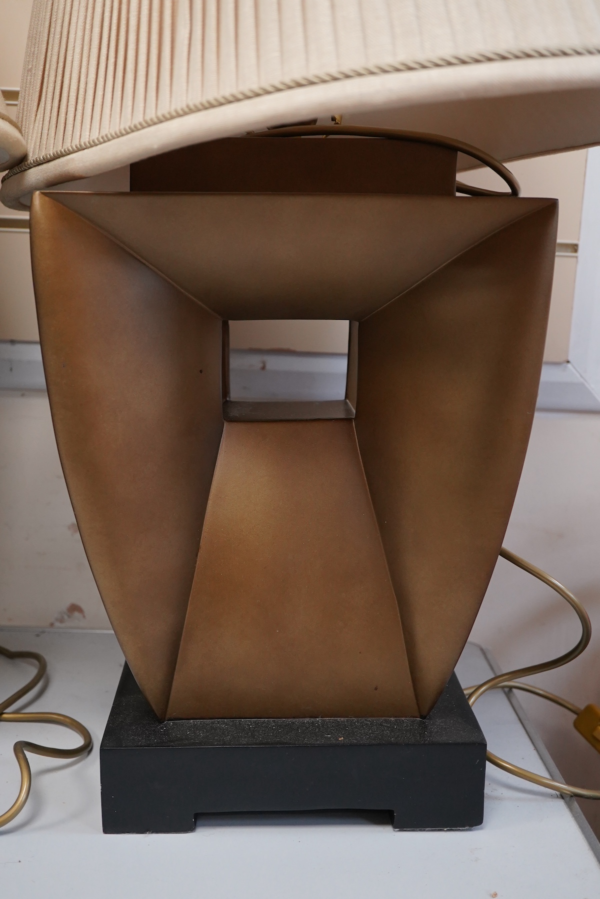 A pair of Art Deco style gilt composition table lamps and shades